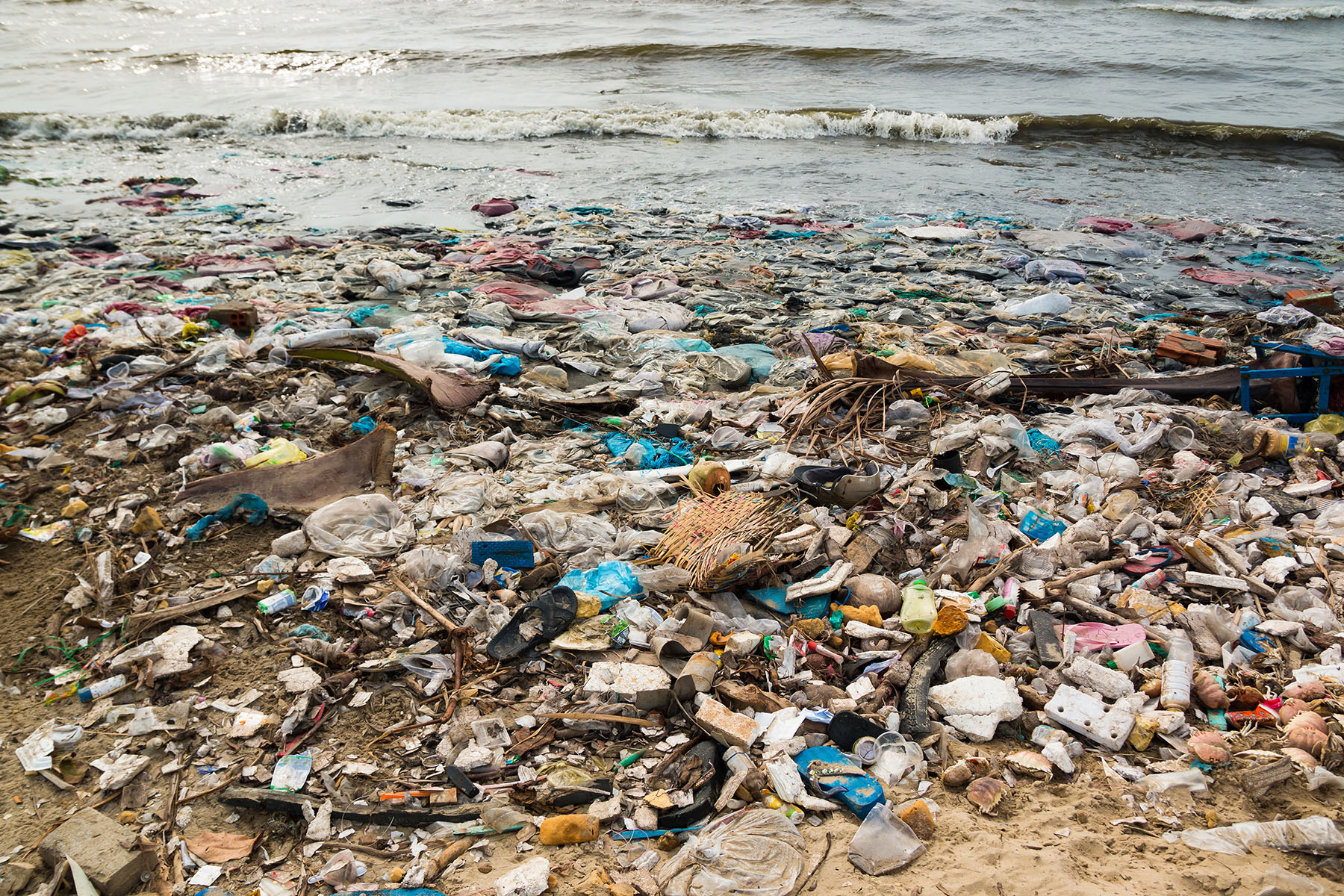 Polluted beach in fishing village, environment, pollution